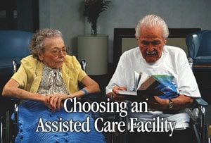 Senior man and woman sitting in wheelchairs reading a book