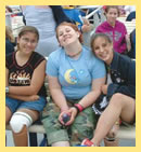3 girls sitting together, smiling