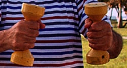 Man holding a weight in each hand